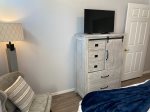 A modern bedroom chair & TV for viewing